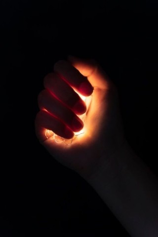 view-hands-tiny-lights_23-2150571044